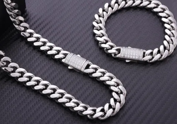 shiny silver chain necklace and bracelet displayed together showcasing luxury jewelry fashion accessories